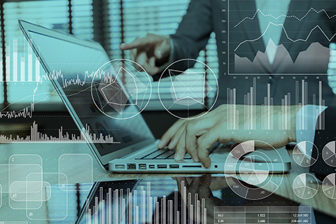 Person typing on laptop overlaid with infographics